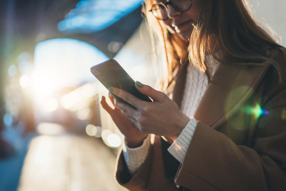 Woman holding mobile phone